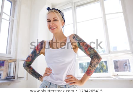 Stock photo: Young Woman Posing With Her Hand On The Waist