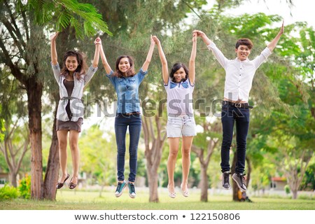 ストックフォト: Ecstatic Young Casual Man Jumping Of Joy Outside