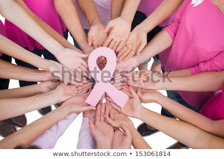 Stockfoto: Standing Woman For Breast Cancer Awareness With Ribbon On White Background