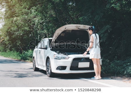 Foto stock: Women With Open Hood Of Broken Car At Countryside