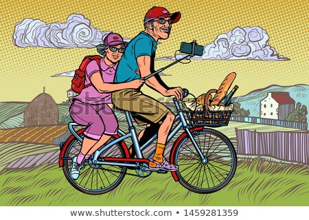 Stockfoto: Old Man And Old Lady Travelers On Bike Selfie On Smartphone