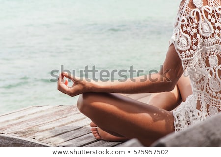 Foto stock: Woman Practices Yoga Asana Outdoors