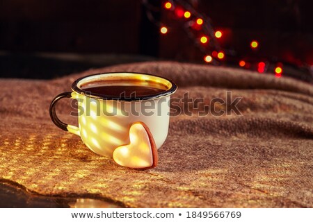 Stock photo: Cup With Shadow Heart On Bokeh Lights