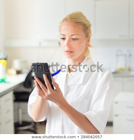 [[stock_photo]]: Young Scientist With A Smarth Phone