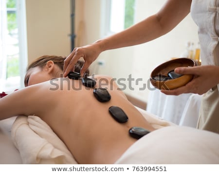 Сток-фото: Couple Receiving Hot Stone Therapy At Spa