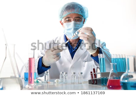 Stock photo: Medical Vials Syringe And Medical Personel