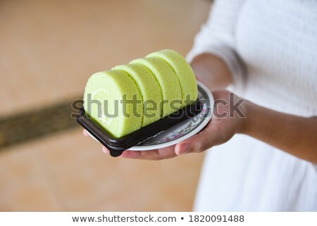 Foto stock: Pastry Cake Biscuit Roulade With Whipped Cream And Chocolate Scrolls