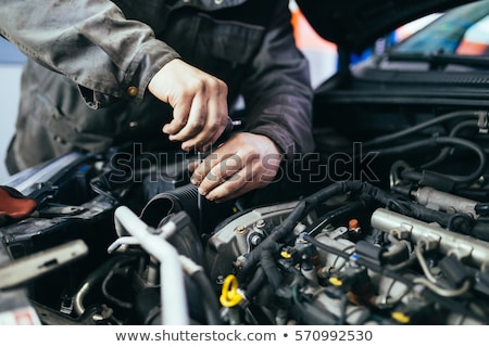 Stockfoto: Auto Mechanic Working In Garage