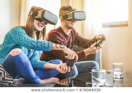 Foto stock: Young Man Playing Video Games Virtual Reality Glasses Cheerful Man Having Fun With New Trends Techn