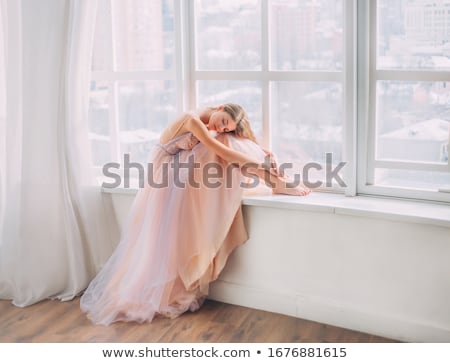 Stock photo: Beautiful Blonde Woman In A Pink Evening Long Dress