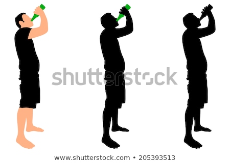 Foto stock: Alcoholism - Silhouette Of Man Drinking Alcohol