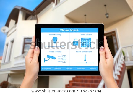 Stock foto: Female Hand Holding House Icon And Keys