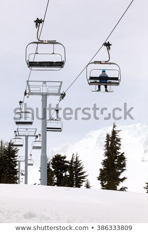 Stock photo: Skier Riding Ski Lifts Up Mount Hood