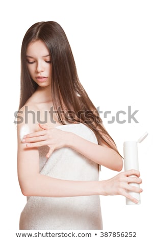 [[stock_photo]]: Young Brunette Using Body Lotion