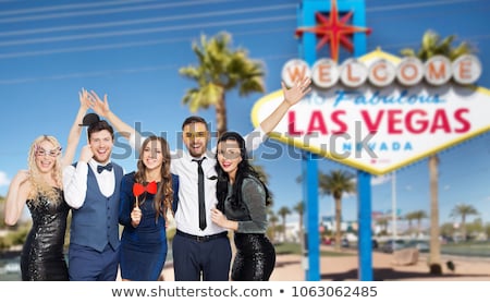 Stok fotoğraf: Happy Friends With Party Props Posing At Las Vegas