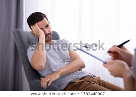 Сток-фото: Psychologist Sitting Near Man Suffering From Depression