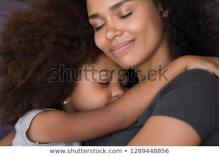 Stock photo: Little Girl Stroking Mothers Face