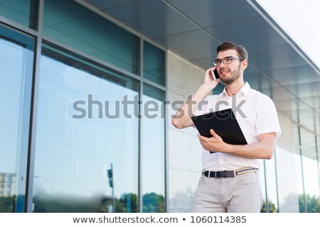 Stock photo: Man Holding A Clipboard