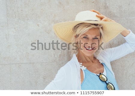 Foto stock: Happy Blonde Woman Wearing Hat