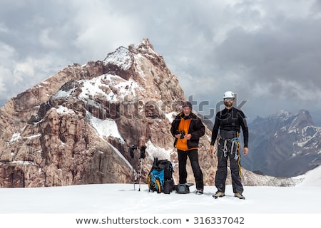 Stockfoto: Group Of Climbers On Rock