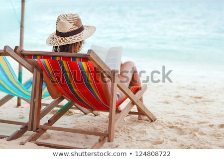 Stock photo: Beautiful Young Woman In Bikini Reading A Book