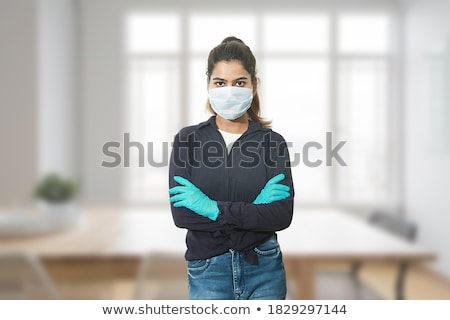 Stockfoto: Portrait Of Standing Woman Wearing Latex Clothes