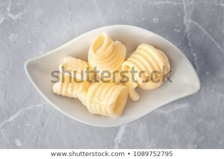 Stok fotoğraf: Butter Curls On Plate