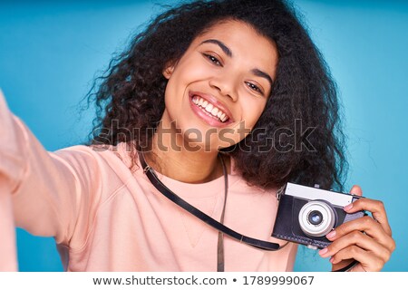 Stock foto: Happy Young Curly Girl Taking Selfie With Retro Camera