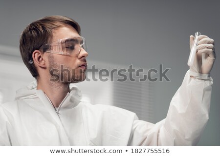 Stock photo: Chemist With The Test Tube In His Hand