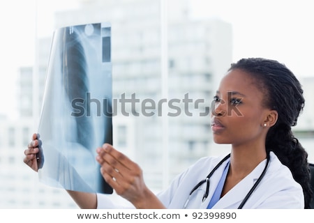 Stockfoto: Young Female Doctor Radiologist Sitting At The Clinic