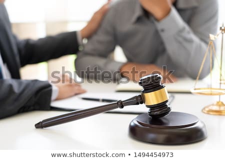 Stock foto: Lawyer Having Meeting And Consoling Solution To His Clients Prov