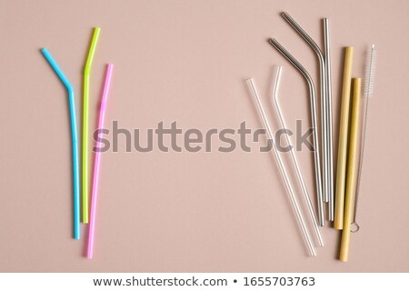 Stockfoto: Bamboo Drinking Straw Vs Disposable Straws On The Background Of The Pool Zero Waste Concept