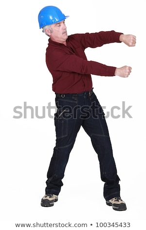 Foto stock: Man Gripping An Invisible Bar