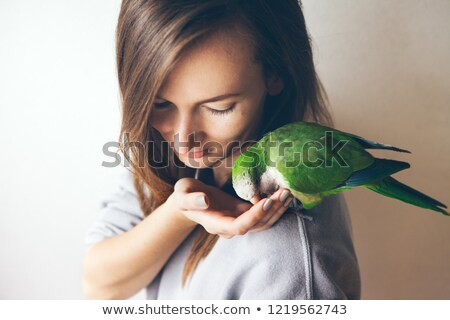 Foto stock: Girl With White Parrot Pet