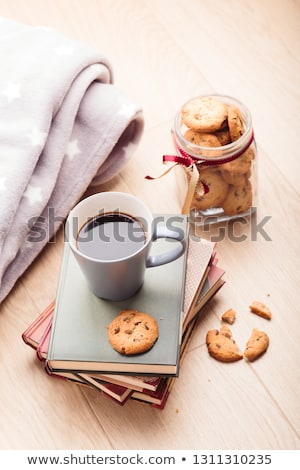 Stockfoto: A Few Books With Cup Of Coffee And Cookies On Wooden Floor