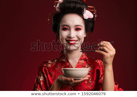 Stockfoto: Image Of Geisha Woman In Japanese Kimono Holding Bowl Plate And