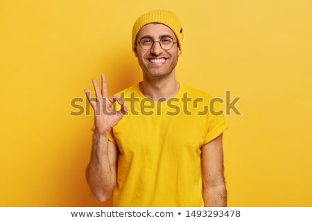 Stock fotó: Happy Young Handsome Man Showing Okay Sign