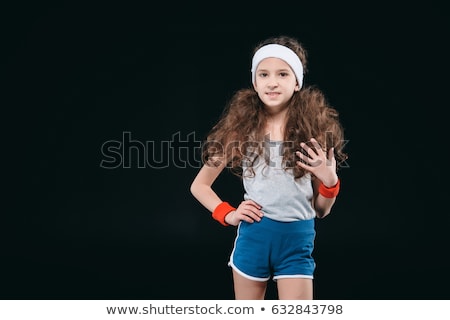 Foto d'archivio: Girl Posing In Sportswear Isolated On Black 12 Year Old Kids Children Sport Concept