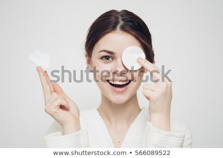 Stok fotoğraf: Portrait Of Young Woman With Cotton Pad