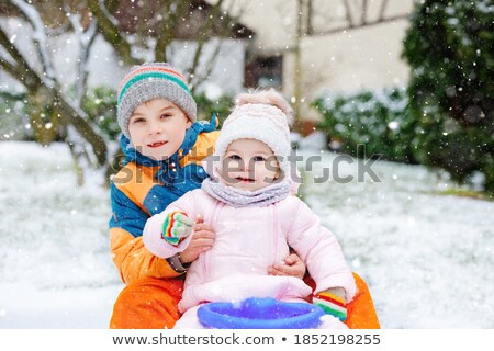 Stock foto: A Cute Boy Enjoying Sleigh Ride During Snowfall