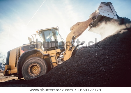 ストックフォト: Bulldozer Putting Biomass On Pile For Composting