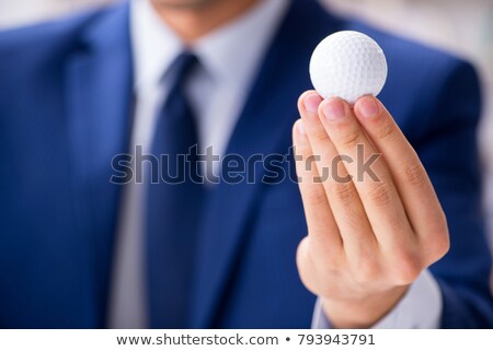 Businessman Holding Golf Club Imagine de stoc © Elnur