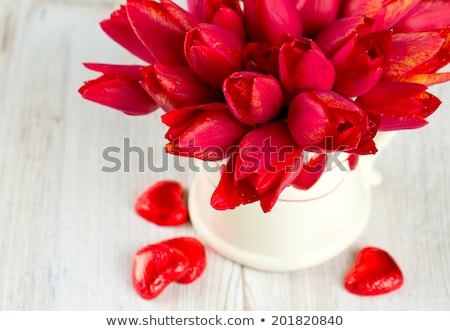 Stock photo: Bouquet Of Beautiful Red Tulips With Greeting On Paper White Bac