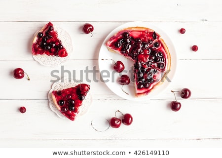 Foto stock: Cake With Red Cherries On Top