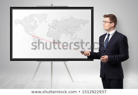 Foto stock: Businessman Presenting Potential Business Area On Map