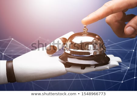 [[stock_photo]]: Person Ringing Service Bell Hold By Robot