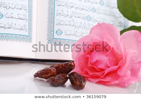 ストックフォト: Holy Islam Book Some Dates And Rose