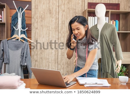Stock fotó: Smiling Professional Woman Designer Leaning At Her Work Desk