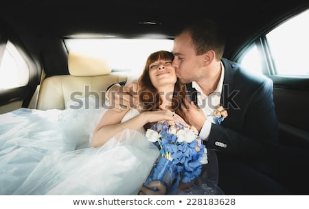 Zdjęcia stock: Couple Kissing On Backseat Of Luxury Car