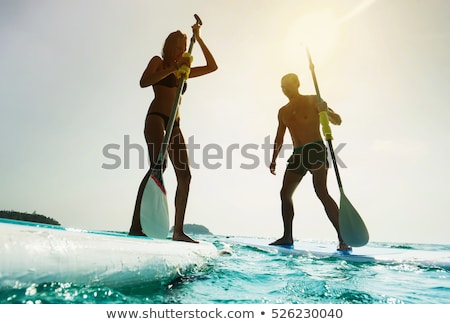 Сток-фото: A Couple Standing By A Lake